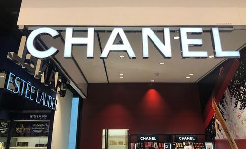 Low angle view of illuminated sign at night