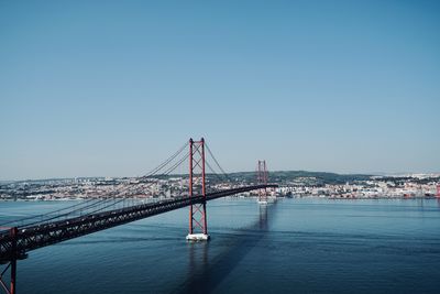 View of the tagus river in lisbon with the bridge of the ponte 25 de abril, lisbon portugal