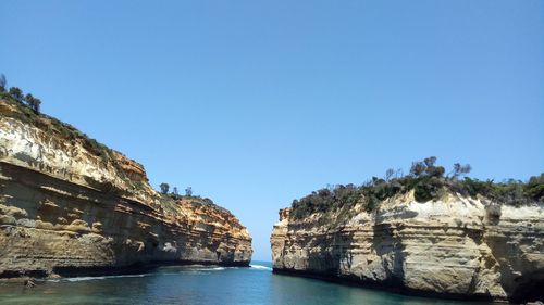 Scenic view of sea against clear blue sky