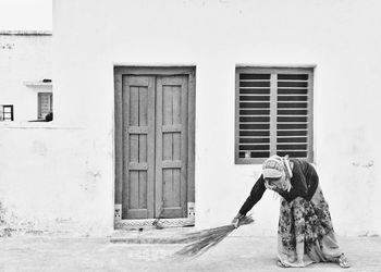 View of woman standing against building