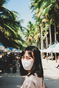 Portrait of woman against trees