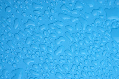 Water drops on blue background