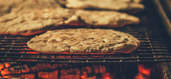 Close-up of flatbread on barbecue grill