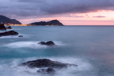 Scenic view of sea against sky at sunset