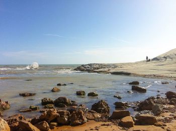 Scenic view of sea against blue sky