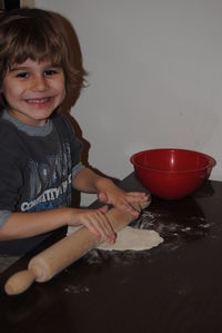 Portrait of smiling boy preparing food at home