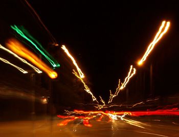 Light trails on road in city at night