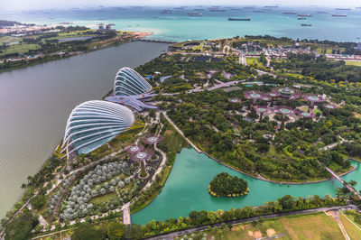 High angle view of buildings by sea