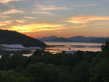 Scenic view of sea against orange sky