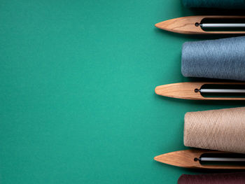 Directly above shot of colored pencils on blue background