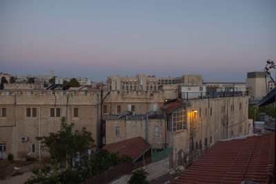 High angle view of buildings against sky at dusk