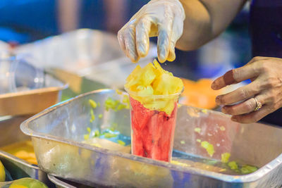 Close-up of hand holding ice cream