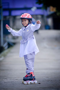 Full length of boy standing on street