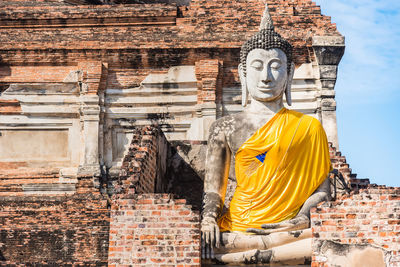 Statue against historic building