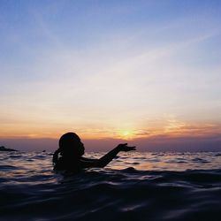 Scenic view of sea at sunset