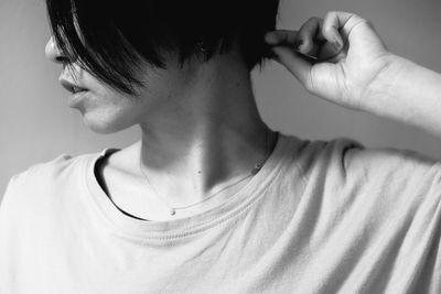 Close-up of woman against white background