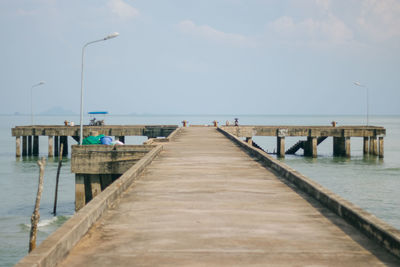 Pier over sea against sky