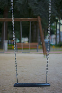 Close-up of swing in park