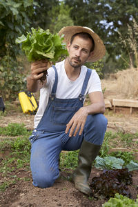 Portrait of senior woman with vegetables