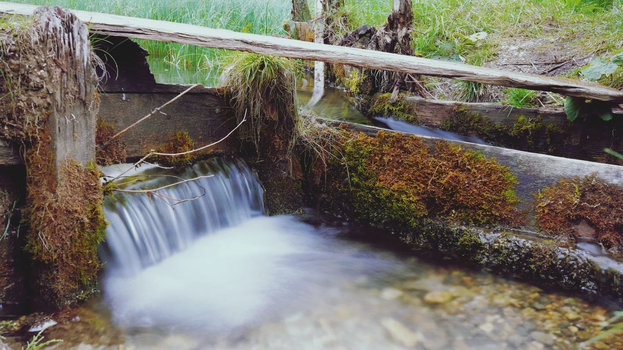 STREAM FLOWING THROUGH BRIDGE