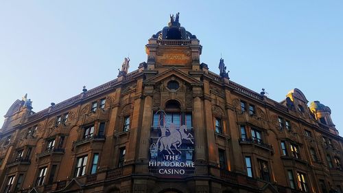 Low angle view of building against blue sky