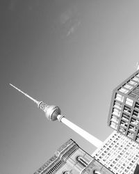 Low angle view of communications tower against sky