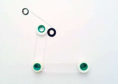 Close-up of green object over white background