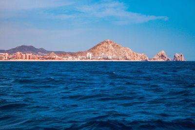 Scenic view of sea against blue sky