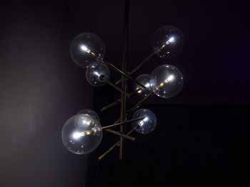 Low angle view of light bulb hanging from ceiling