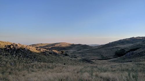 Scenic view of arid landscape against clear sky