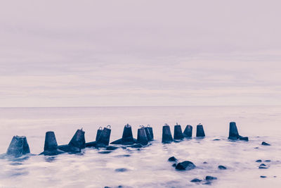 Scenic view of sea against sky during winter