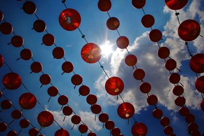 Full frame shot of lanterns hanging against cloudy sky