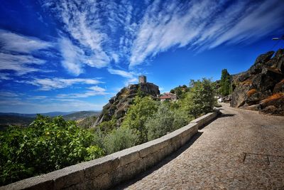 Scenic view of mountains against blue sky