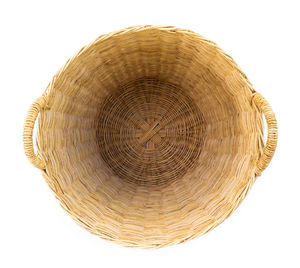 Close-up of wicker basket on white background