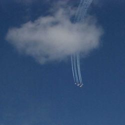 Low angle view of airplane flying against clear sky