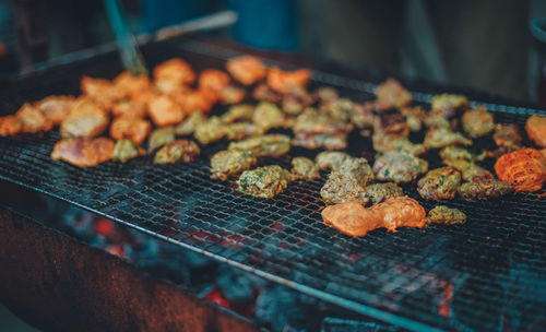 Close-up of meat on barbecue grill