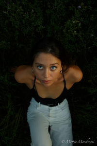 Portrait of beautiful woman standing on land