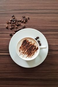 Directly above shot of coffee served on table