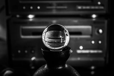 Close-up of crystal ball in darkroom