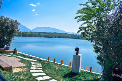 Scenic view of lake against blue sky