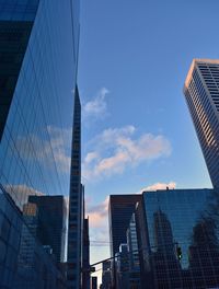 Low angle view of modern buildings against sky