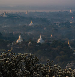 High angle view of stupas at dusk