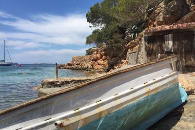 Boat moored by sea