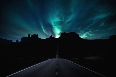 Scenic view of road against sky at night