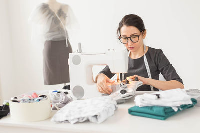 Portrait of a woman working on table