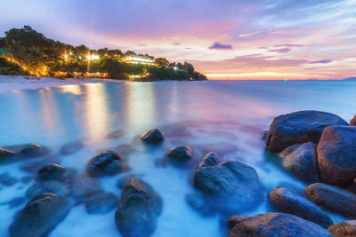 Scenic view of sea against sky at sunset