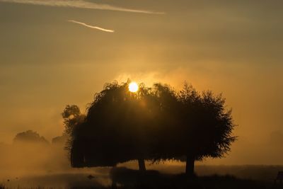 Scenic view of landscape against sky during sunset