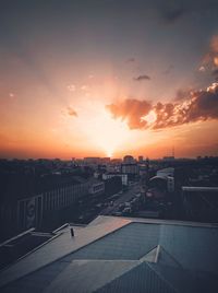 High angle view of buildings against sky during sunset