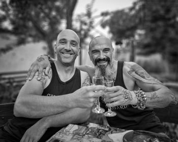 Portrait of friends sitting outdoors