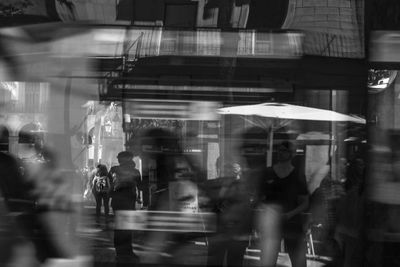 People walking in city at night